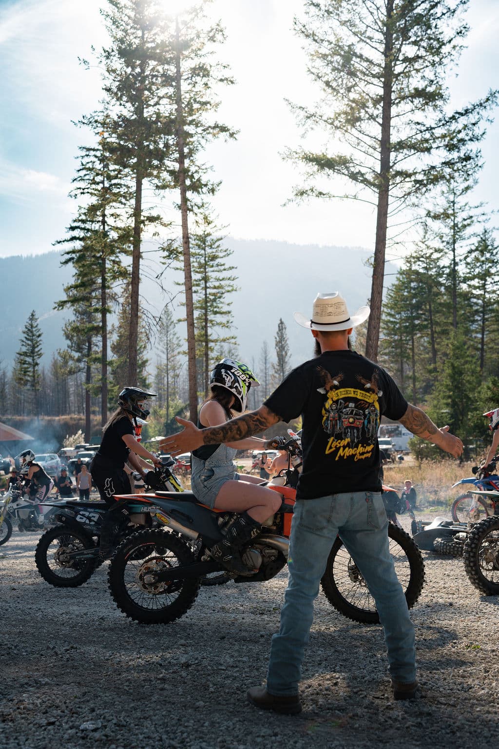 A rider getting a fist bump send-off before hitting the trail.