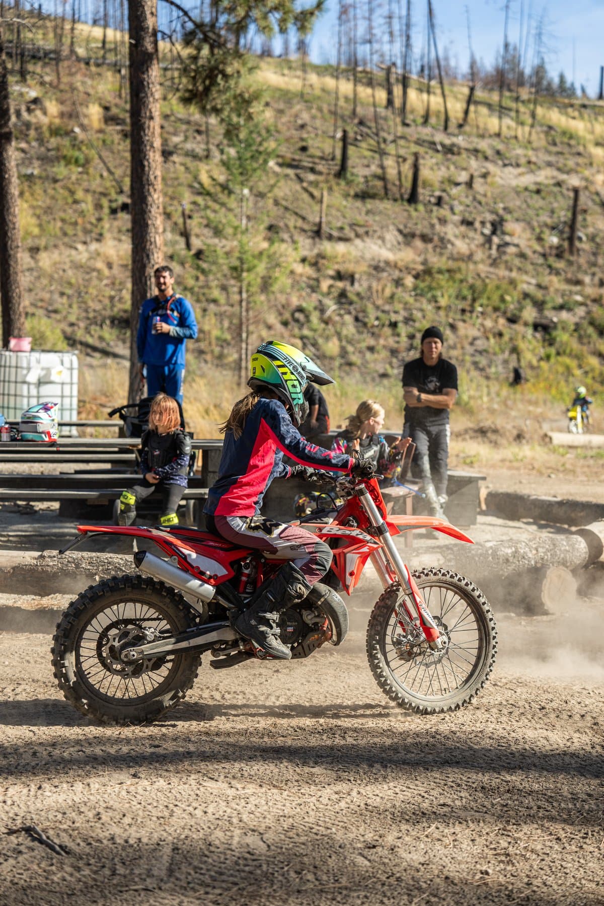 A rider kicks up dust leaving the staging area at a Dusthunniez ride.